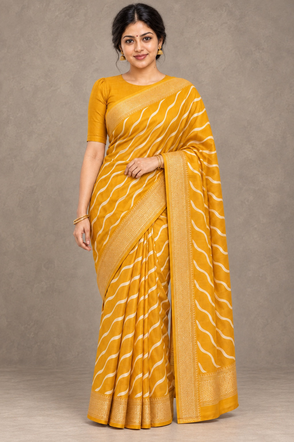 Ochre Yellow Wave-Line Saree with Gold Border – styled model photo